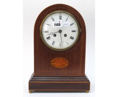 An Early XX Century Mahogany Inlaid Mantle Clock, with an enamel dial, Roman numerals, batwing marquetery inlay, on stepped b
