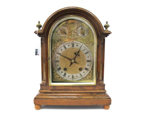 A Late XIX Century Oak Cased Mantle Clock, the brass dial plate with silvered chapter ring with Roman numerals below a chime 