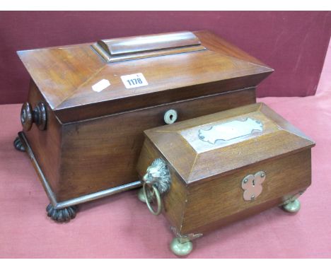 A Mid XIX Century Mahogany Tea Caddy, of sarcophagus form raised on fluted feet (one missing), the interior with two lidded c