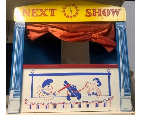 A wooden puppet show theatre, with fold in collapsible back. 