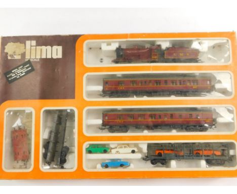 A Lima HO scale model train set, containing an LMS engine, 060, 4683, LMS red livery, together with two coaches and assorted 