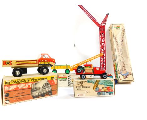 Three Kovap tin plate toys, boxed, comprising a Hawkeye type E 1924, a tractor and trailer and a crane, together with a Russi