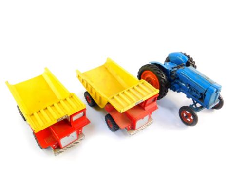 A Chad Valley die cast model of a Fordson Major Tractor, together with two Dinky Toys Aveling Barford SN 35 dump trucks. (3)