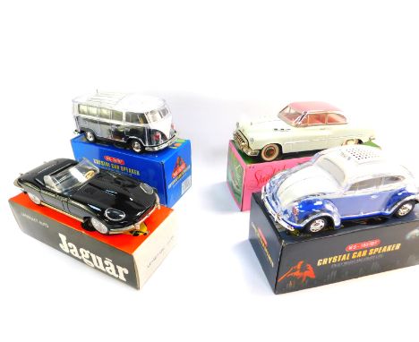 A Music World VW Beetle crystal car speaker, VW camper van Music World speaker, friction powered standard Sedan, and a model 