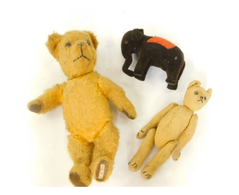 An English golden mowhair straw filled growler teddy bear, 38cm high, a hunch back bear with jointed arms and legs, black but