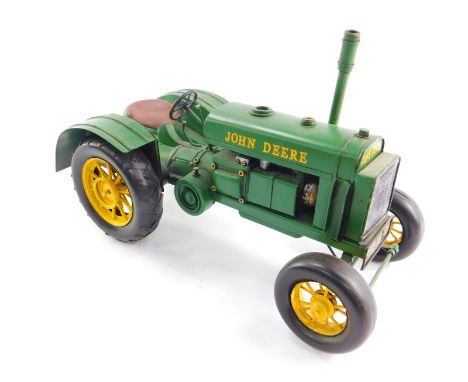 A tin plate model of a John Deere 1931 GP tractor, 38cm wide. 