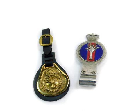 A J R Gaunt 1950's chrome and enamel Welsh Guards car badge, together with a Welsh Guards horse brass. (2)