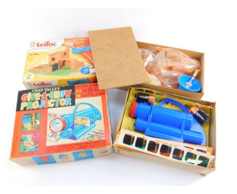 A Chad Valley give a show projector, battery operated with slides, boxed, together with a Tiefoc set, build and play with rea