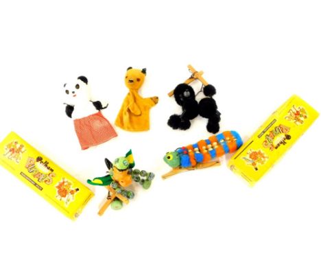 Two Pelham puppets, Baby Dragon and Caterpillar, boxed further puppet black poodle, together with Sooty &amp; Sweep hand pupp