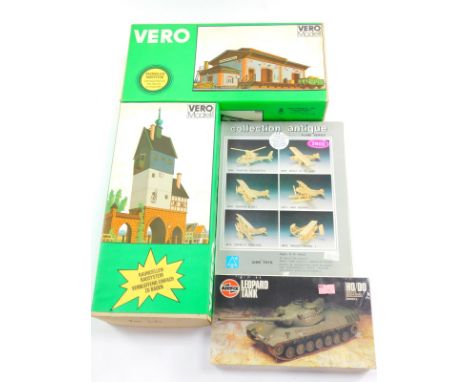 Two Vero models, of a goods station and a town gate, together with an Airfix model of a Leopard tank, and an Aymes Toys Plane