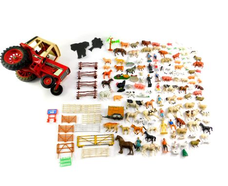 A diecast International 1086 tractor, together with plastic farm yard animals, fencing, further figures, etc. (2 trays)