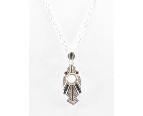 A silver Art Deco style pendant necklace. The necklace having geometric pendant with a synthetic opal cabochon to the centre 