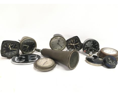 A Collection of aircraft and car clocks including Smiths and a Russian example, a vintage car horn, GB badge, vintage Lucas K