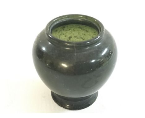 A Chinese miniature Spinach jade vase, 6cm tall this lot cannot be posted. Small chip on the base.