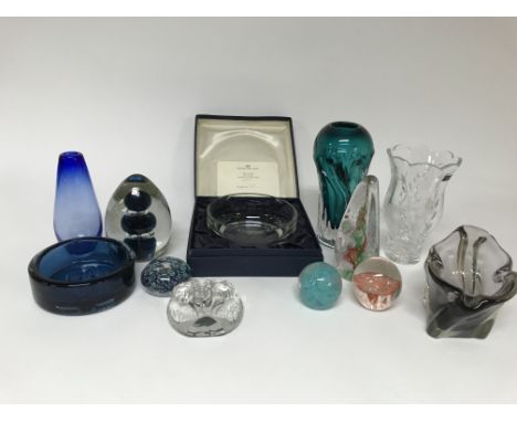 A mixed collection of glassware including paperweights bowls and vases as well as a limited edition Caithness mayflower piece