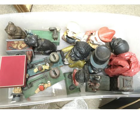 A Collection of vintage and modern money boxes including cast iron Uncle Sam, Bull dog bank, Trick dogs, Artillery bank etc. 