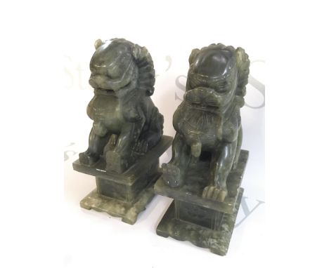 A pair of Chinese jade lion dogs , 19cm tall. This lot cannot be posted