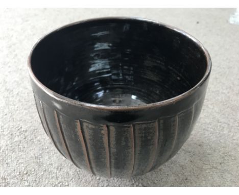 A David Leach stoneware bowl with brown glaze and incised decoration. 18cm