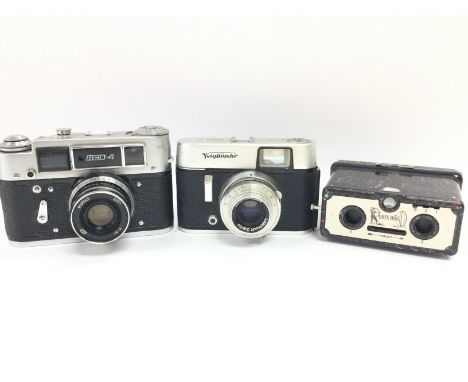 3 Cameras. A Robin Hood. A Russian made Fez 4 and a Voigtlander Vito C. NO RESERVE