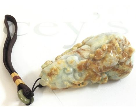 A Chinese carved Jade pebble , 9cm long this lot cannot be posted