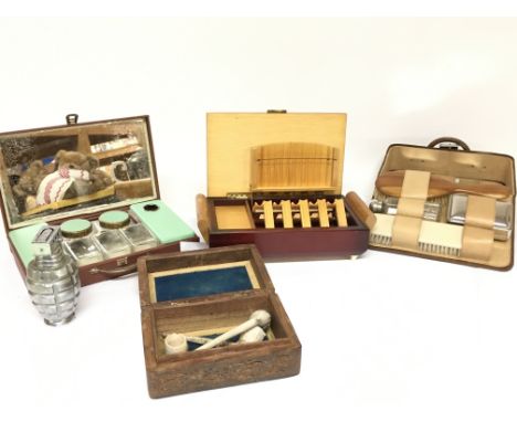 A a cigarette/cigar box, novelty grenade table lighter, carved wooden trinket box with clay pipes and dressing kits. Postage 