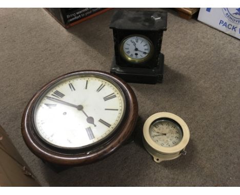A collection of clocks including a slate mantle clock, oak wall clock and a B.C.G Lemania metal clock. This lot cannot be pos