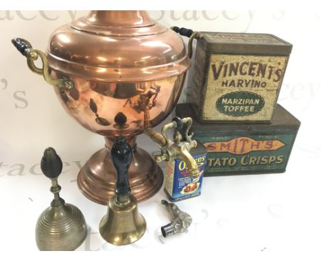 A copper Samovar, vintage tins, bells and a silver plated lion design walking stick topper. Samovar 36cm tall. Postage catego