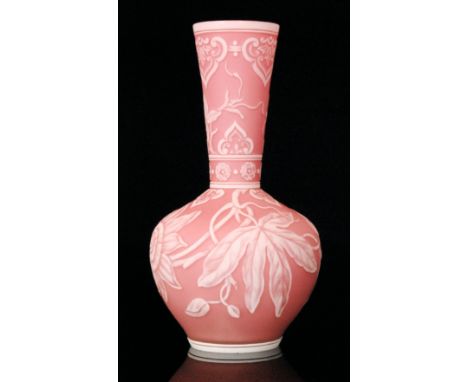 A late 19th Century Stevens & Williams cameo glass vase of footed spherical form with a flared collar neck, cased in opal ove