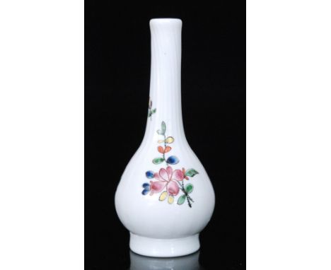 A mid 18th Century white or milch glass posy vase of footed globe and shaft form with fluted neck, Staffordshire enamel decor