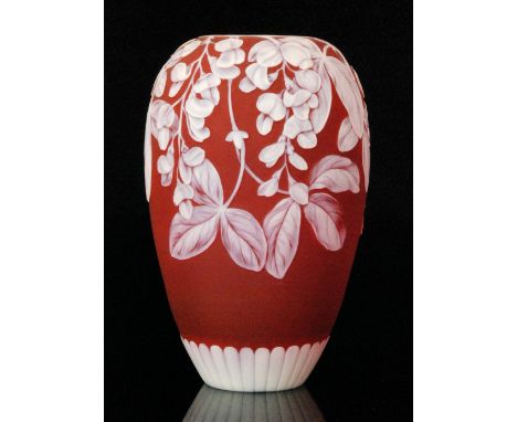 A late 19th Century Thomas Webb & Sons cameo glass vase of ovoid form, cased in opal over ruby and cut to the whole with flow