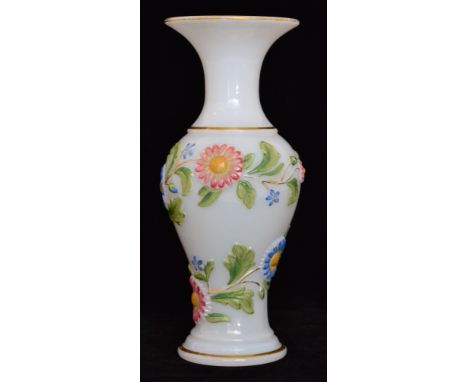 A 19th Century Baccarat vase of baluster form with a flared collar neck, relief moulded with a spiral band of flowers and fol