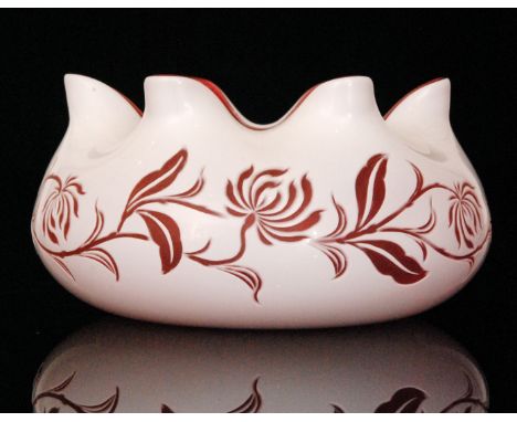 A late 19th Century Stourbridge glass bowl, possibly Stevens & Williams, of compressed ovoid form with wide wave rim, cased i