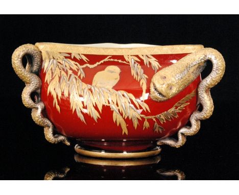 A large late 19th Century Thomas Webb & Sons glass bowl of footed triform cased in ruby over opal and decorated with three ap