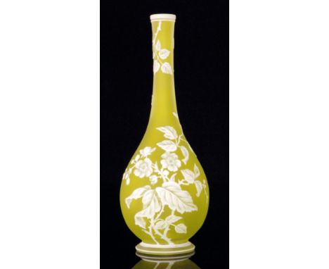 A late 19th Century Thomas Webb & Sons cameo glass vase of footed slender globe and shaft form cased in opal over citron and 