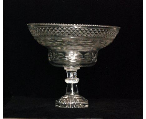 A large late Georgian Anglo-Irish pedestal bowl circa 1800 with everted rim circular bowl cut with repeat panels of decoratio