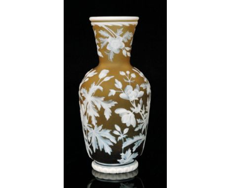 A late 19th Century Thomas Webb & Sons cameo glass vase of footed, shouldered ovoid form with flared collar neck, cased in op