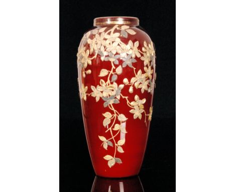 A late 19th Century Stourbridge glass vase of shouldered ovoid form with shallow collar neck, cased in deep ruby over opal an