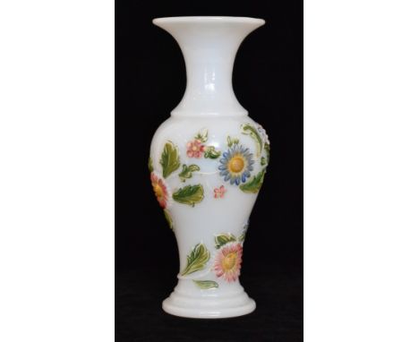 A 19th Century Baccarat vase of baluster form with a flared collar neck, relief moulded with a spiral band of flowers and fol