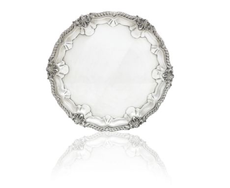 A LATE VICTORIAN SILVER SALVERBy R & W Sorley, London, 1900 in the mid eighteenth century manner with three scroll feet and w