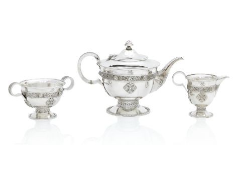 A GEORGE V THREE PIECE CELTIC REVIVAL SILVER TEA SERVICEBy James Weir, Glasgow, 1913 Each piece based on the Ardagh chalice a