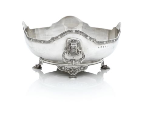 A GEORGE V CELTIC REVIVAL SILVER BOWLBy Elkington and Co. Birmingham, 1913 On four pad feet, the shallow bowl with wavy rim a