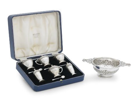 A CELTIC STYLE SILVER QUAICHBy West & Co, Dublin, 1905 Embossed with a band of zoomorphic strapwork and with corresponding pi