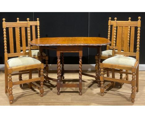 A set of four early 20th century oak bobbin-turned dining chairs, c.1935; an oak barley twist gateleg dining table, pie-crust