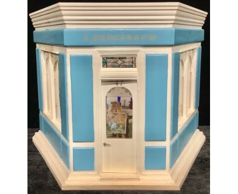 A doll's house miniature antique shop emporium, fitted with assorted miniatures in the manner of Clarice Cliff, Doulton, Goeb