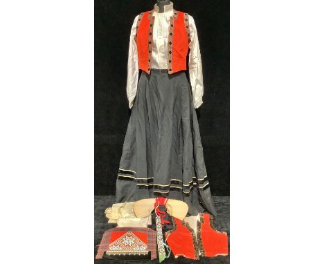 Costume - a Norwegian lady's traditional folk costume or Bunad, comprising embroidered dress and brocade vest, lace worked li