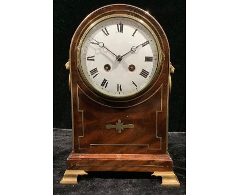 A late 19th century mahogany domed bracket type mantel clock, brass inlay, pair of lion mask loop handles, white enamel dial,