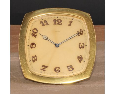 An Art Deco gilt brass easel strut timepiece, 8.5cm clock dial inscribed with luminous Arabic numerals, Swiss eight-day keyle
