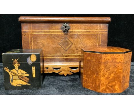 An early 19th century provincial casket, the whole outlined with boxwood tramlines, the rounded rectangular hinged top enclos