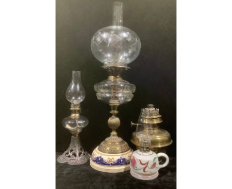 A Victorian oil lamp, clear cut glass font, brass knopped column, ceramic base, cut glass ovoid shade, 64cm overall; other oi