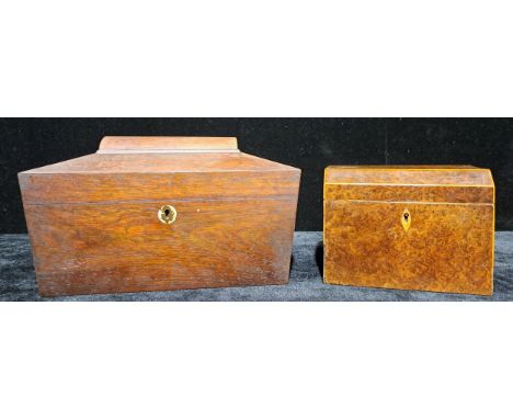 A 19th century mahogany sarcophagus tea caddy, the hinged cover enclosing two lidded compartments and mixing bowl aperture, 3
